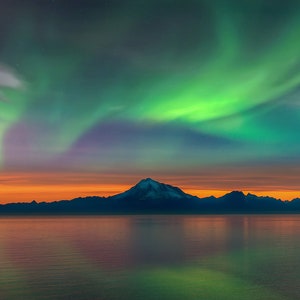 Northern Lights - Stunning Landscape of the Aurora Borealis over Mount Redoubt Volcano on the Cook Inlet in Alaska at sunset