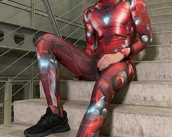 May include: A long-sleeved, full-length bodysuit featuring a red and metallic-toned graphic print that mimics mechanical armor plating, including a central chest arc reactor design, paired with black athletic sneakers with thick soles.