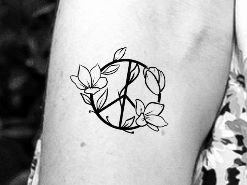 Skeleton peace sign tattoo w flowers  Peace sign tattoos Tattoos Tattoo  designs