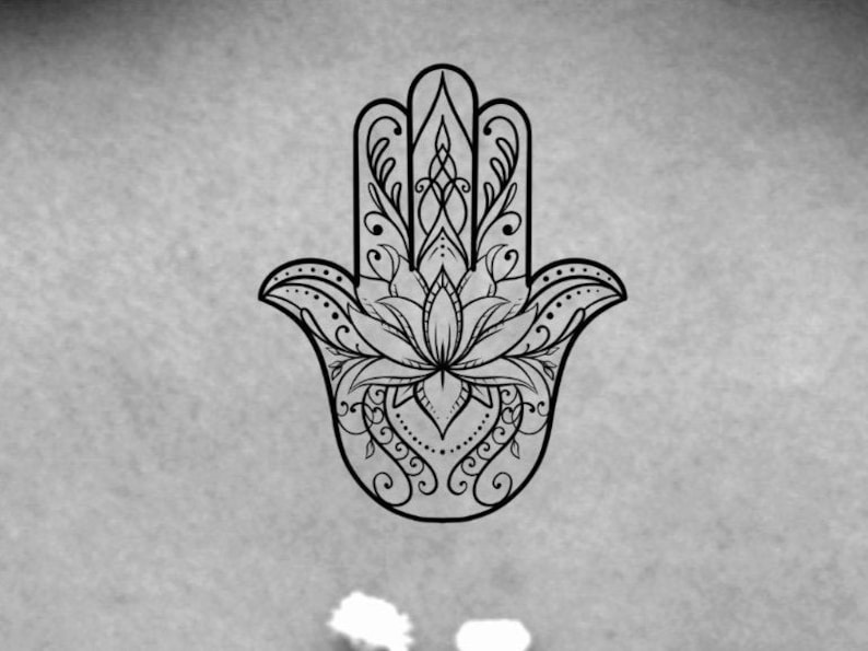 May include: A black and white line drawing of a hamsa hand with intricate details, including a lotus flower in the center.