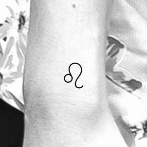 May include: A black line drawing of the astrological symbol for Leo, the lion.