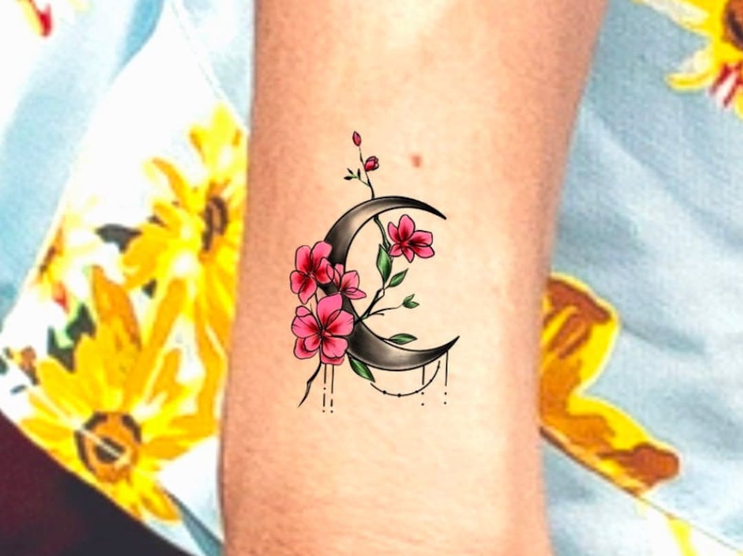 Flower moon tattoo on the ankle
