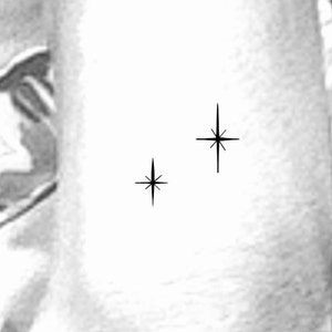 May include: Two black starburst shapes on a white background.