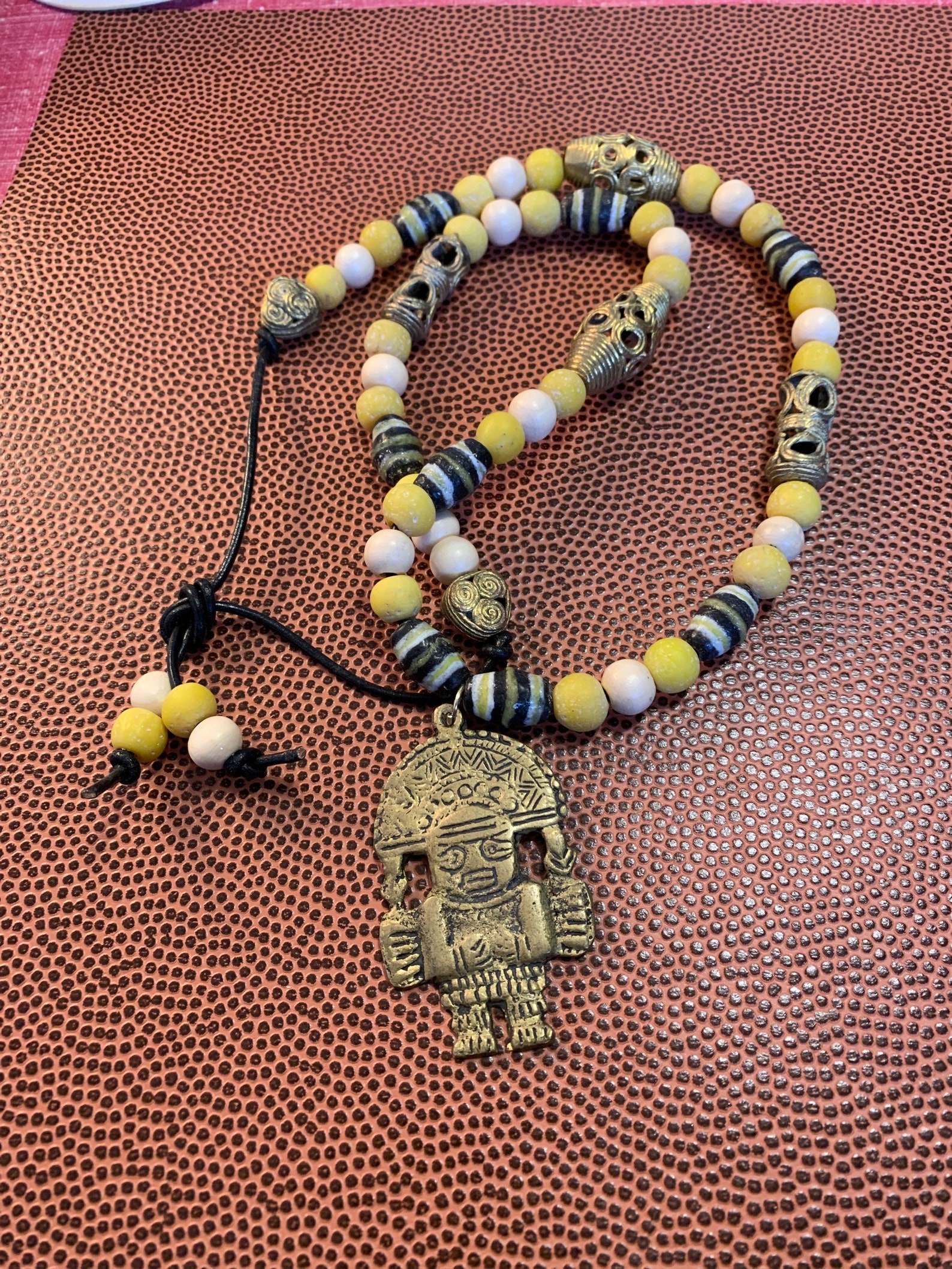 Mayan inspired brass pendant necklace. Etsy