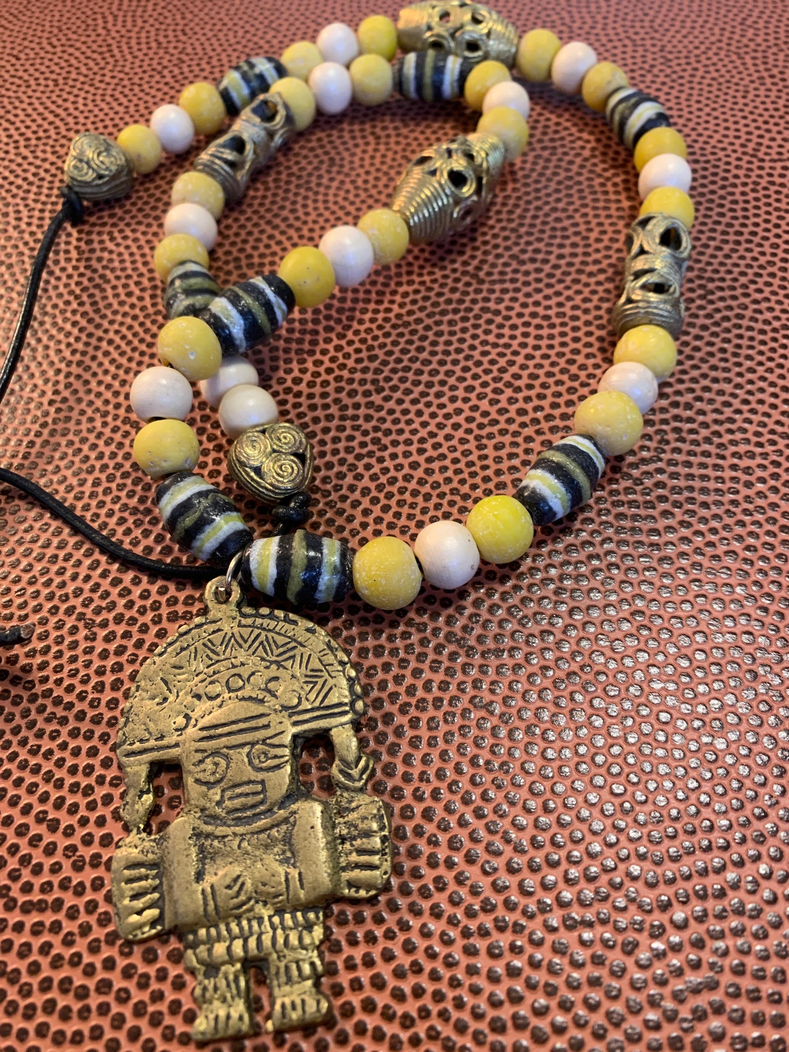 Mayan inspired brass pendant necklace. Etsy