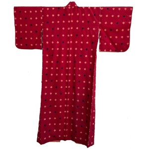 May include: A red kimono with a black and pink diamond pattern.