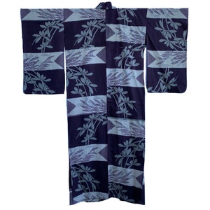 May include: A traditional Japanese kimono with a blue and white floral pattern. The kimono is made of a lightweight fabric and has a relaxed fit.