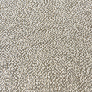 May include: Close-up of a beige fabric with a textured woven pattern.