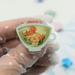 Goldfish Tea Cup Acrylic Pin ~ Kawaii Cute Pastel Green Fish Charm Badge Accessory Pet Betta Animal Nature Cottagecore Plant Leaves