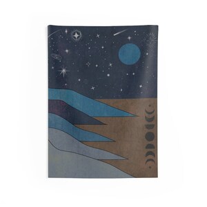 May include: A tapestry featuring a stylized landscape with blue and brown mountains under a dark blue night sky with a large blue moon and white stars. The moon phases are depicted on the right side of the tapestry.