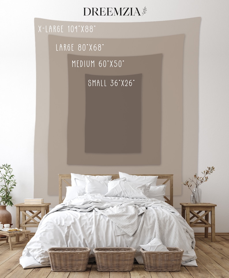 May include: A white bed with a white blanket and pillows, a brown wooden headboard, and two wicker baskets at the foot of the bed. The bed is in front of a wall with a beige tapestry hanging on it. The tapestry has text that reads "X-LARGE 101"x88", "LARGE 80"x68", "MEDIUM 60"x50", and "SMALL 36"x26".