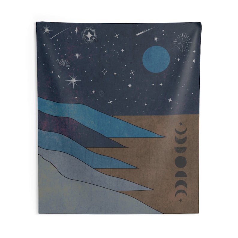 May include: A tapestry featuring a stylized landscape with blue mountains and a brown desert under a dark blue night sky with a full moon and stars. The moon phases are depicted on the right side of the tapestry.