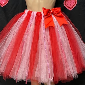 Red and pink colored adult tutu embellished sparkling pink ribbons enhances it’s beauty
