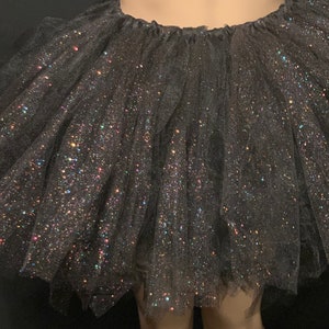 Women shimmering and sparkling black tutu