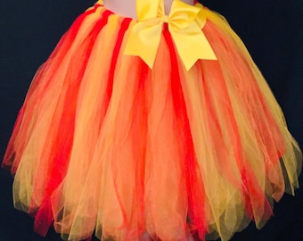 Tutú de fuego llameante: largo extra largo hasta la rodilla, lazo amarillo