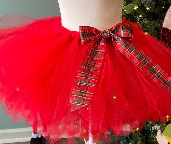 Festive holiday red adult Christmas costume with  a large traditional plaid holiday  bow
