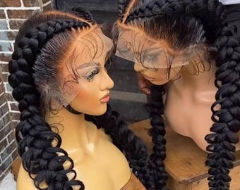 May include: Two black wigs with long braids styled in a French braid pattern. The wigs are on mannequin heads and are displayed on wooden stands.