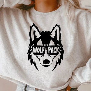 May include: A gray sweatshirt with a black wolf wearing sunglasses and the text "Wolf Pack".