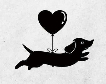 Op de afbeelding: Een zwart silhouet van een teckel die een hartvormige ballon vasthoudt. De hond vliegt door de lucht.