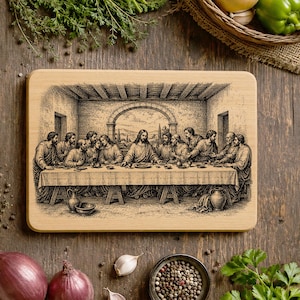 May include: A rectangular light-colored wooden cutting board featuring a detailed black ink illustration of The Last Supper. The artwork depicts a central figure seated at a long table with twelve individuals, set within an arched room.