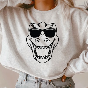 T-rex con gafas de sol SVG, diseño de camiseta DIY de Mamasaurus rex, dinosaurio genial SVG, dinosaurio lindo SVG, diseño de sublimación genial de T-rex