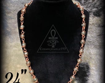 May include: A copper-toned necklace with gray-green beads, displayed on a black bust. The necklace is 24 inches long. The beads are wire-wrapped with copper. The CosmicJewelz777 logo is visible.