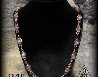 May include: A copper-colored necklace with round, iridescent stones, displayed on a black mannequin. The necklace is approximately 24 inches long. The CosmicJewelz777 logo is visible in the bottom right corner.