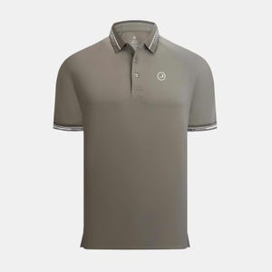 May include: A short-sleeved polo shirt in a muted olive green. The collar and sleeve cuffs feature a white and black striped trim. A small white logo is on the left chest. The shirt has a three-button placket.