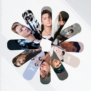 May include: A collection of oval-shaped bookmarks arranged in a circular pattern. Each bookmark features a different image of a person. The bookmarks are in various colors, including black, gray, and blue. The background is white.