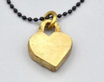Small  heart brass pendant necklace for her .
