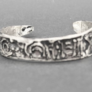 silver cuff bracelet , open silver women bracelet ,a hammered bracelet Inspired by an ancient script