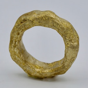 An African-inspired goshen brass ring ,in two colors gold and blackened