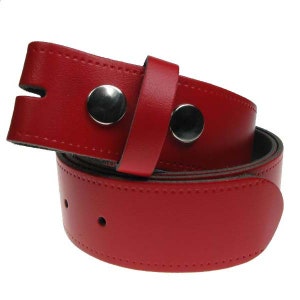 May include: A red leather belt with two silver metal belt loops. The belt is folded in half, showing the inside of the belt.