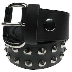 May include: Black leather belt with silver pyramid-shaped studs. The belt has a silver buckle.