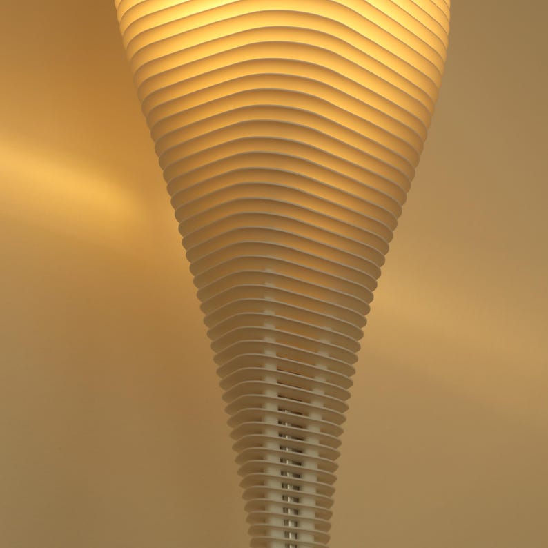 May include: A modern, white, layered pendant light fixture. The design features numerous horizontal, curved slats that create a spiraling, cone-like shape. The light emits a warm, inviting glow, suggesting a contemporary home decor element.