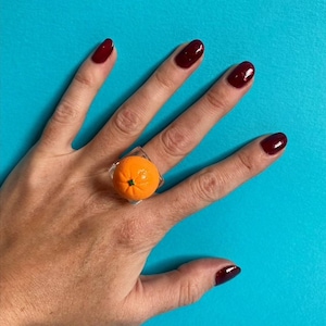 Anillo de fruta naranja de plástico grueso