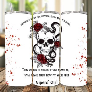 May include: A white ceramic mug with a black handle and the text "But First, Coffee" in a handwritten style. The mug is on a white surface. The mug is approximately 10 cm tall.