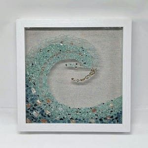 Gorgeous Ocean Wave Art in Seaglass colored, crushed glass. Frame color options with crushed sea shells and sleek clean front. Great gift!