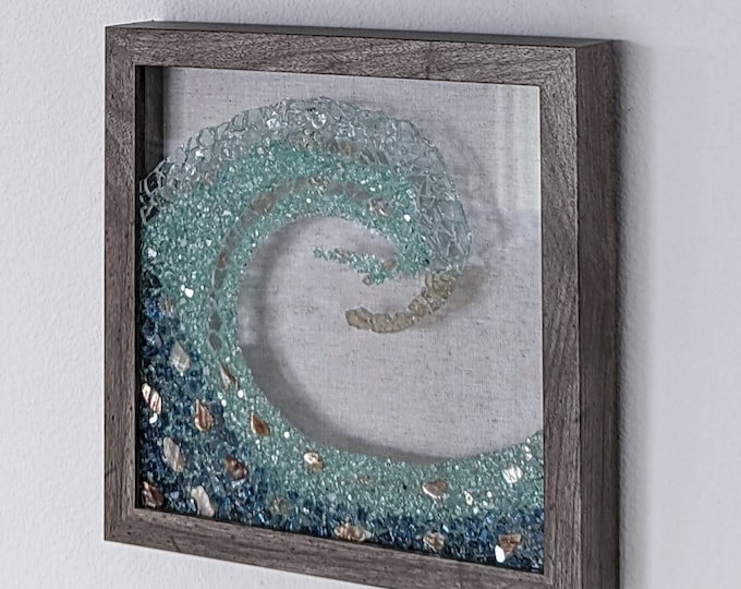 Gorgeous Ocean Wave Art in Seaglass colored, crushed glass. Frame color options with crushed sea shells and sleek clean front. Great gift!