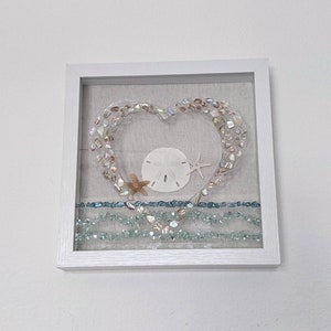 Heart Ocean Scene in Shadowbox with a real Sand Dollar, Starfish, and pretty crushed sea shells. Bring a piece of the beach home. Great Gift