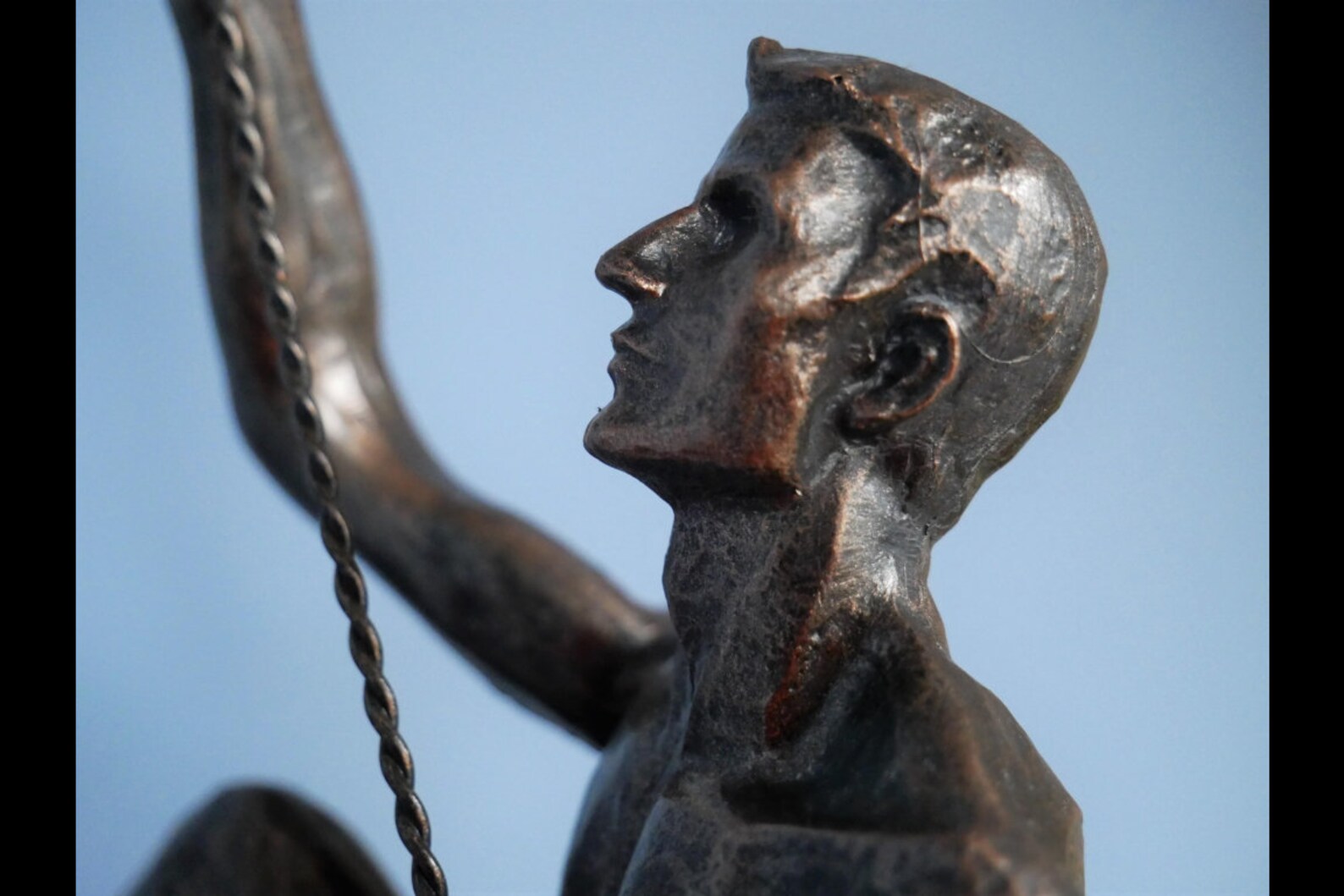 bronze abseiling figures