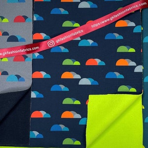 May include: Three fabric swatches with a repeating pattern of colorful semi-circles. The fabrics are in shades of gray, blue, and teal. The fabric swatches are labeled with the website "gkfashionfabrics.com".