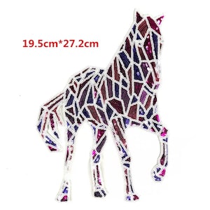 May include: A purple and pink sequined horse applique measuring 19.5cm by 27.2cm. The horse is designed with a geometric pattern.