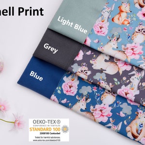 May include: Four swatches of softshell fabric in light blue, grey, blue, and a floral print with deer, owls, and foxes. The fabric is Oeko-Tex Standard 100 certified.