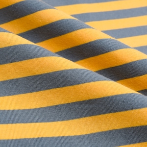 May include: Close-up of a yellow and gray striped fabric. The fabric is folded and has a soft, textured appearance.