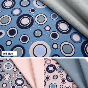 Peut inclure: Tissu softshell avec un imprimé numérique de cercles bleus, verts et blancs sur un fond bleu clair. Le tissu est déperlant, respirant et possède une couche de TPU collée. Le tissu est présenté en trois couleurs : bleu foncé, vert foncé et rose pâle.