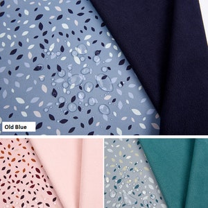 May include: Softshell digital print fabric samples in old blue, old pink, and old green, alongside a navy blue swatch. The fabric is water repellent, TPU layer bonded, and breathable. The text 'SOFTSHELL DIGITAL PRINT FABRIC' is visible.