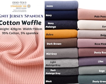 Peut inclure: Un assortiment de tissu en coton gaufré extensible en jersey tricoté, dans des couleurs variées comme pêche pâle, marine et ocre. Le tissu mesure 150 cm de large et pèse 420 g/m, composé de 95% de coton et 5% d'élasthanne. Le texte "Knit Jersey Spandex Cotton Waffle" est également présent.