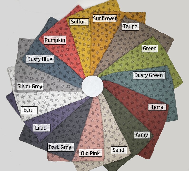 May include: A color chart of fabric swatches with a sunburst pattern. The swatches are arranged in a circle and labeled with color names: Pumpkin, Dusty Blue, Silver Grey, Ecru, Lilac, Dark Grey, Old Pink, Sand, Army, Terra, Dusty Green, Green, Taupe, Sunflower, and Sulfur.