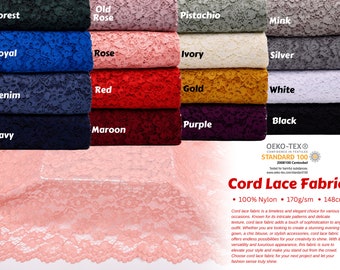 May include: A close-up of a pink cord lace fabric with a delicate floral pattern. The fabric is 100% nylon, 170 grams per square meter, and 148 centimeters wide. The fabric is certified by Oeko-Tex Standard 100, meaning it is tested for harmful substances.